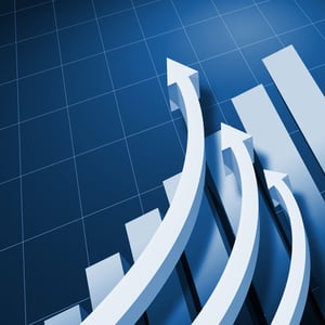 Charts and upward directed arrows against blue background